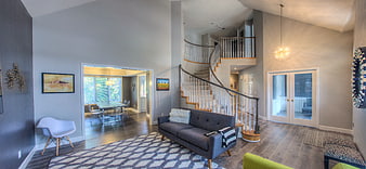 Modern Living Room with Spiral Staircase and High Ceilings