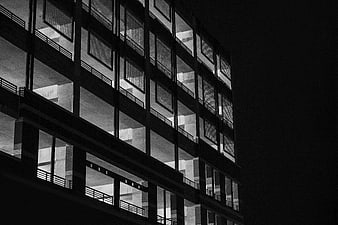 Black and white modern building facade at night