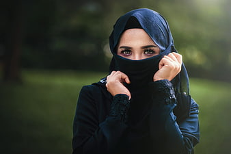 Woman in Blue Hijab and Niqab in Park
