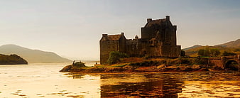 Eilean Donan Castle at Sunset with Golden Reflections