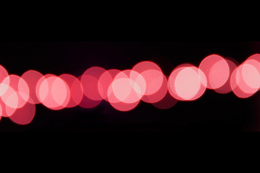 Abstract Red Bokeh Lights on Black Background