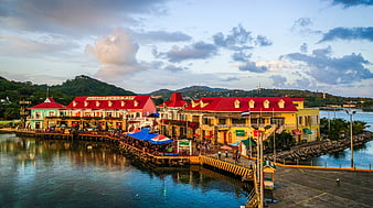Colorful waterfront buildings in Roatan, Honduras at dusk