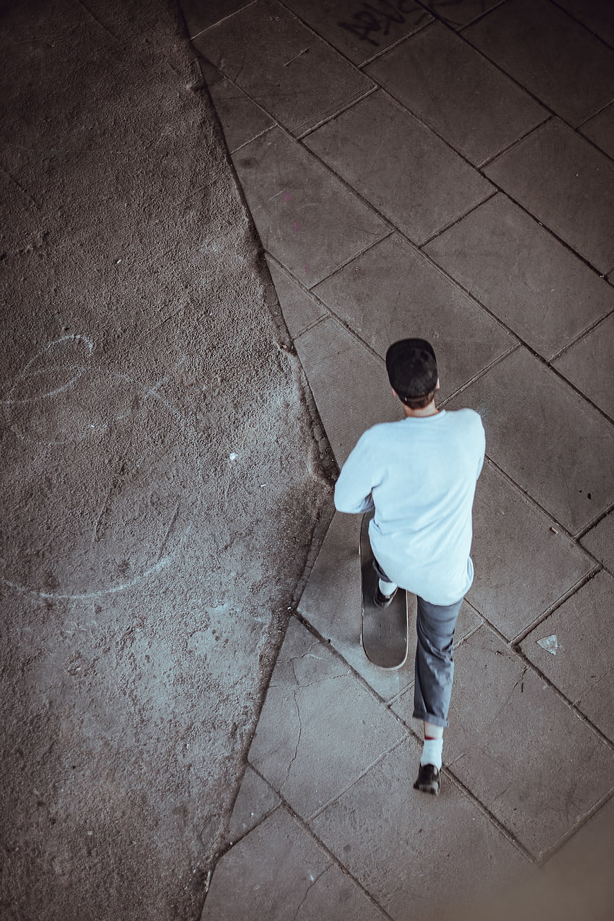 High angle view of skateboarder on city street