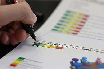 Hand Marking Satisfaction Survey With Black Pen
