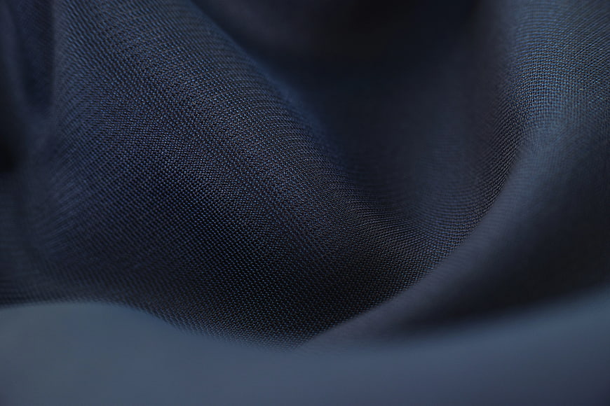 Close-up of dark blue textured fabric weave