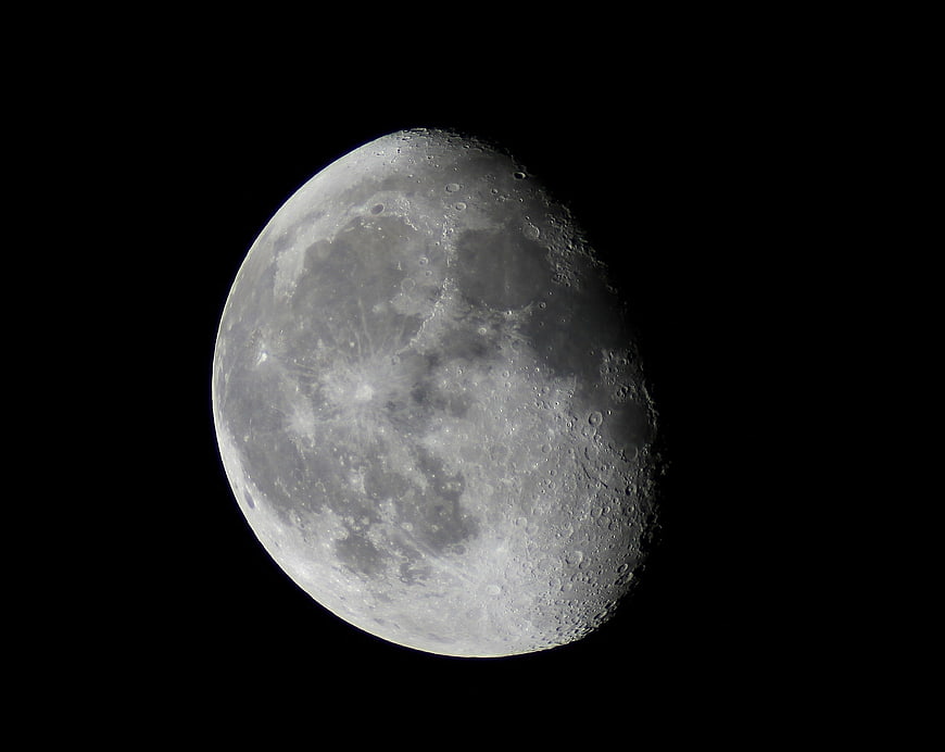 Detailed Waxing Gibbous Moon Against Black Night Sky