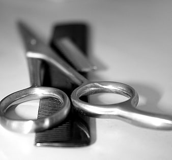 Black and White Barber Scissors and Comb Close Up