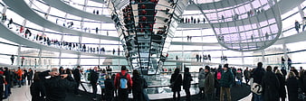 Panoramic view of tourists inside the Reichstag glass dome in Berlin