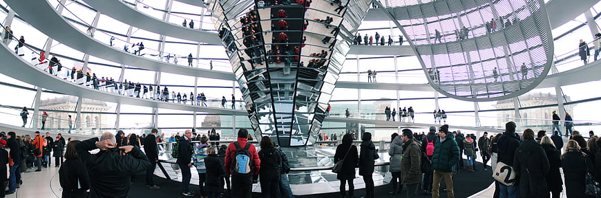 Panoramic view of tourists inside the Reichstag glass dome in Berlin