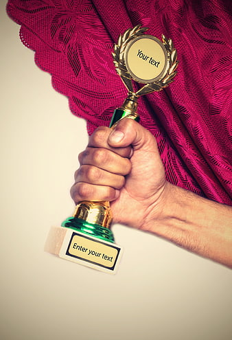 Hand Holding Gold Trophy With Placeholder Text Against Red Curtain