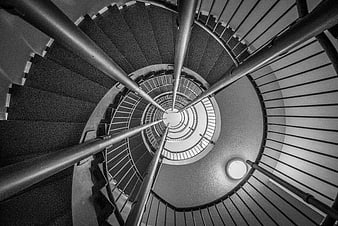 Black and white spiral staircase looking down from above