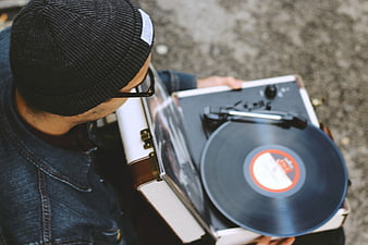 Man with Vintage Record Player and Vinyl