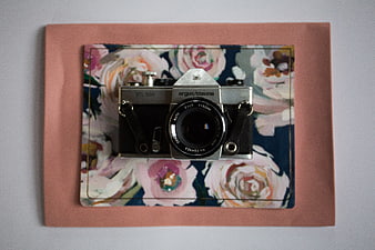 Vintage Argus/Cosina Camera on Floral Background