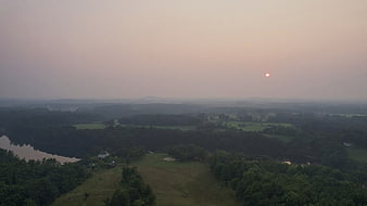 Aerial View of Hazy Rural Landscape at Sunset
