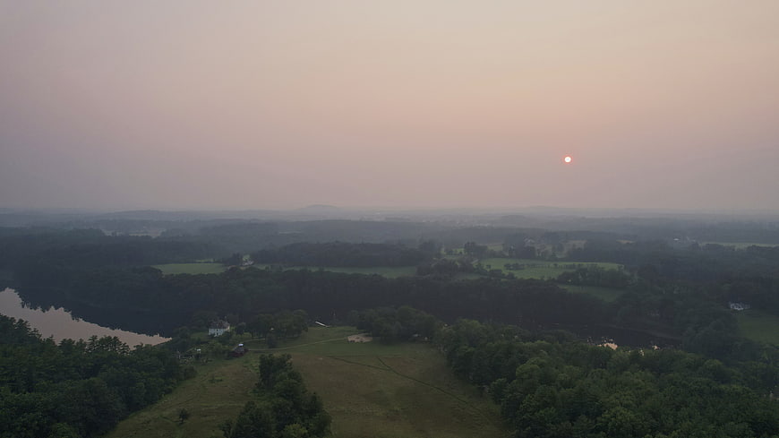 Aerial View of Hazy Rural Landscape at Sunset