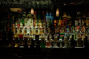 Backlit Bar Shelves with Assorted Liquor Bottles