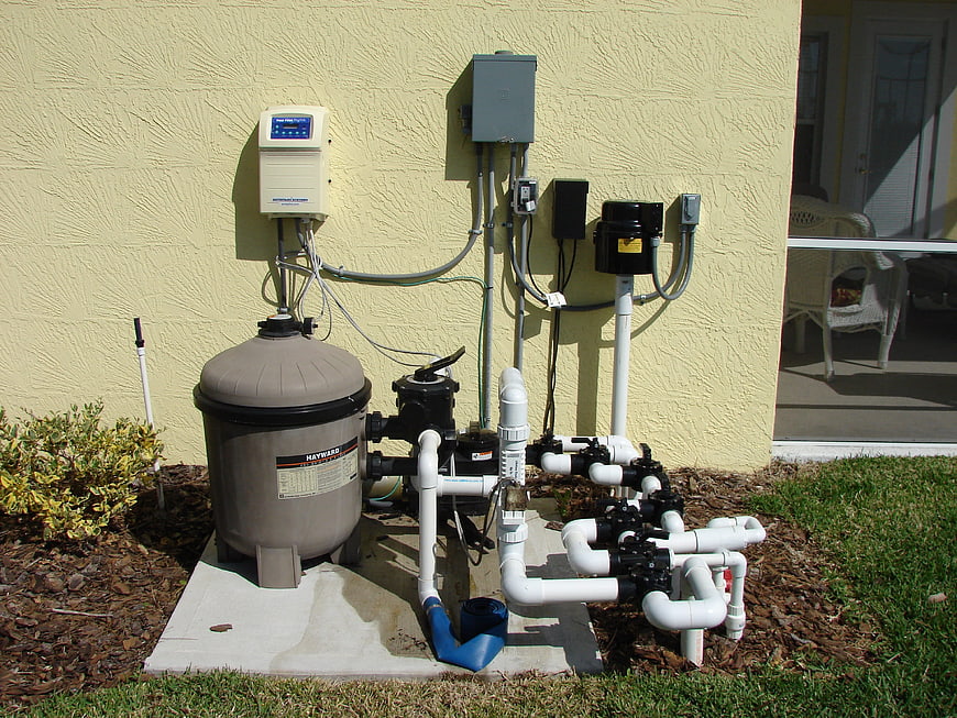 Outdoor Pool Filtration System with Pump and Pipes