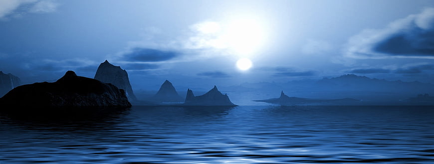 Mystical Blue Ocean Landscape With Silhouetted Rocks And Moonlight