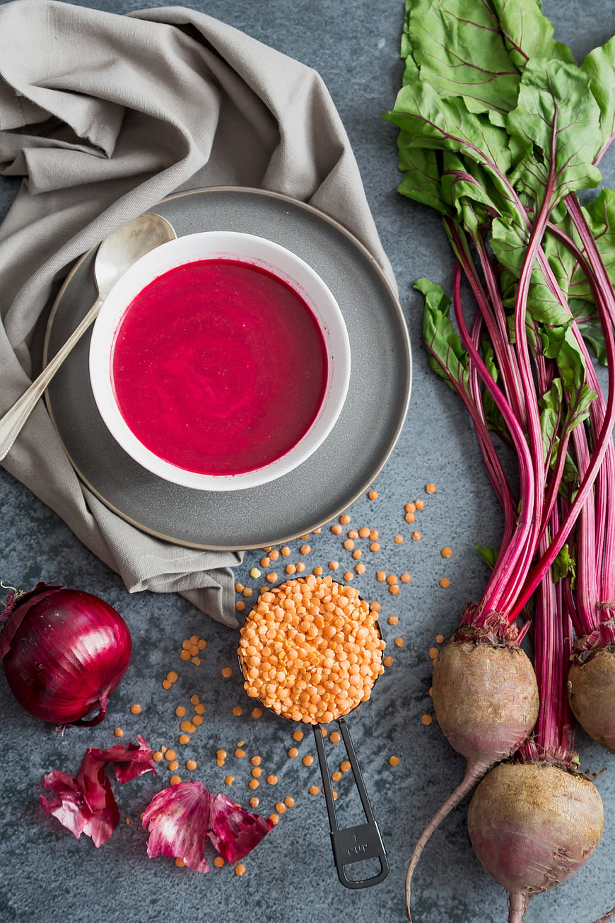 Top View of Vibrant Beet and Lentil Soup with Fresh Ingredients