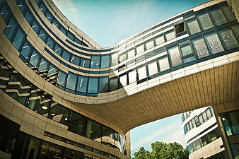 Low angle view of modern curved office building architecture