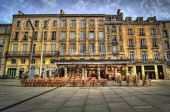 Empty French cafe terrace in historic European square