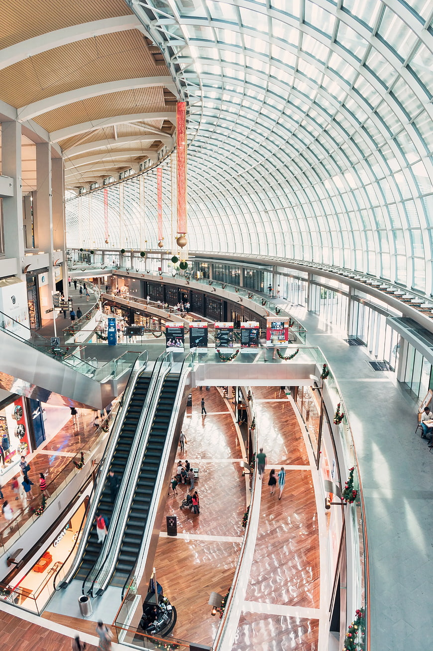 High Angle View of Modern Shopping Mall Interior with Glass Roof