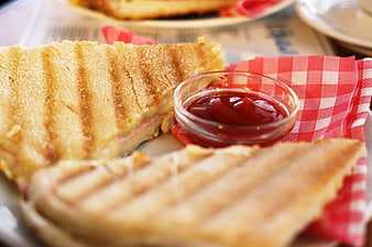 Grilled Cheese Sandwich With Ketchup On Red Checkered Napkin