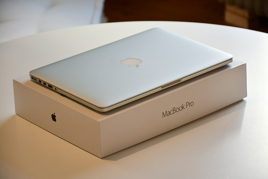 Silver MacBook Pro Laptop on White Box