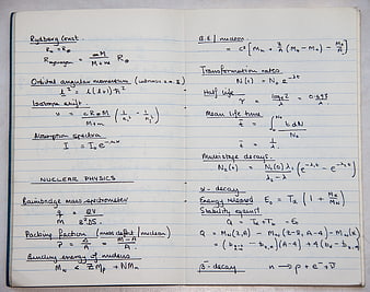 Handwritten Nuclear Physics Formulas in Notebook
