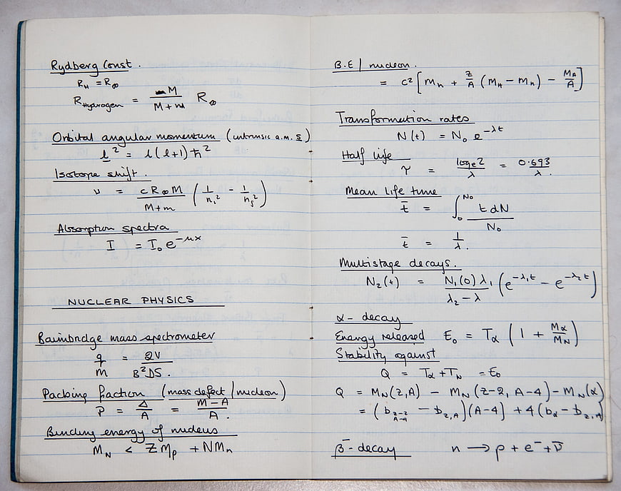 Handwritten Nuclear Physics Formulas in Notebook