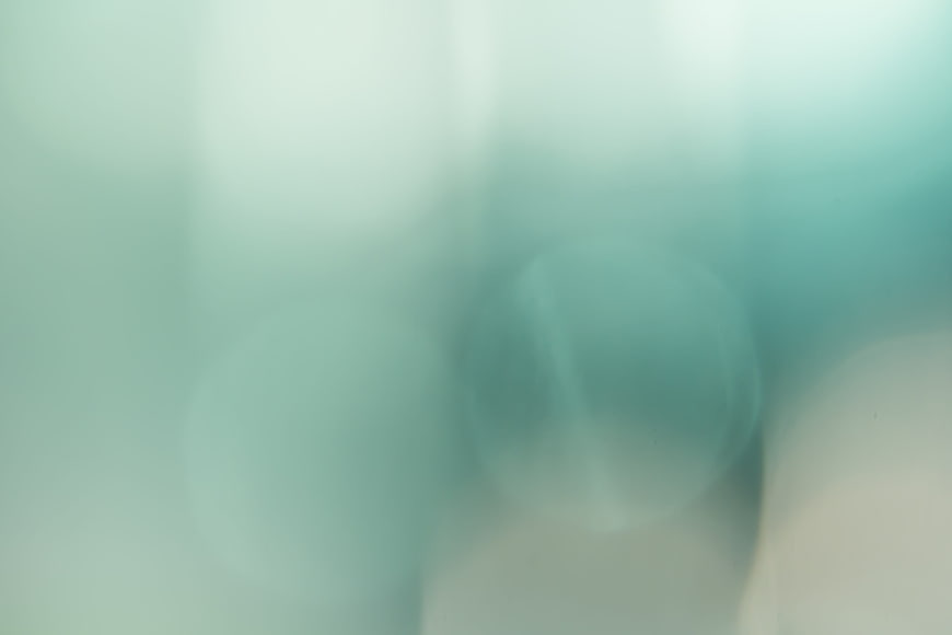 Soft Teal and White Abstract Bokeh Background