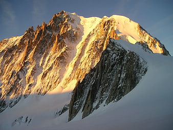 Snow-Capped Mountain Peak at Golden Hour