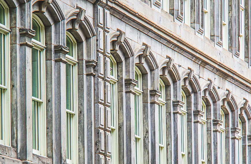 Ornate Gothic Revival Building Facade with Arched Windows