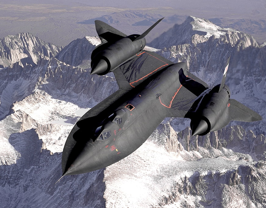 Lockheed SR-71 Blackbird flying over snowy mountains