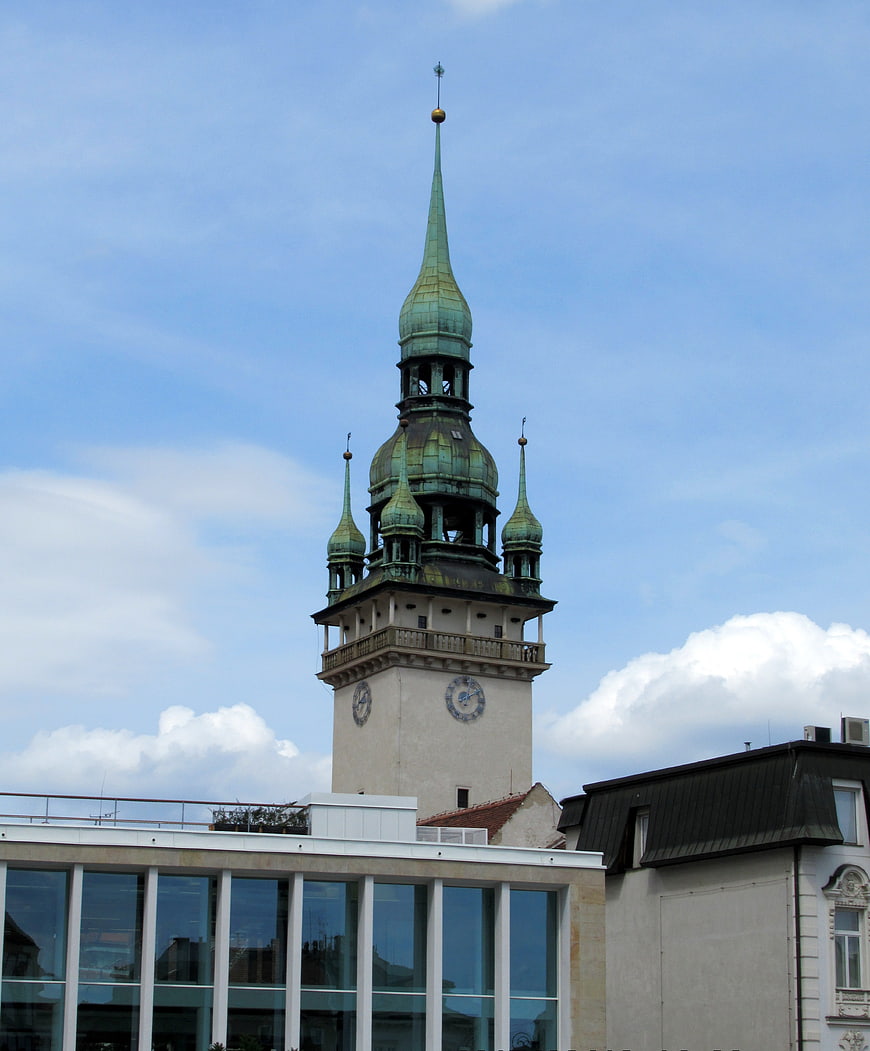 Historic Green Spire Tower Against Blue Sky