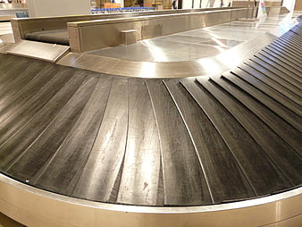 Empty airport baggage claim conveyor belt close-up