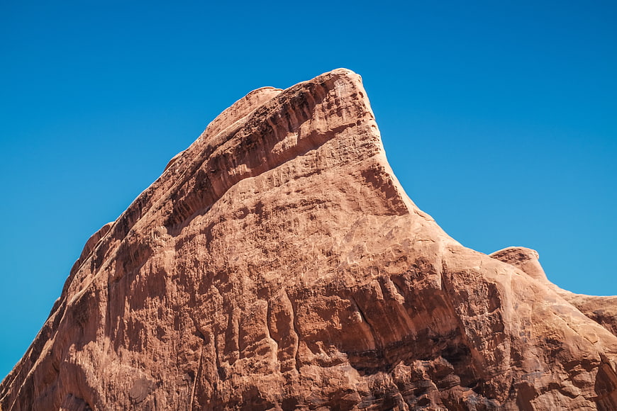 Red Rock Mountain Peak Against Blue Sky