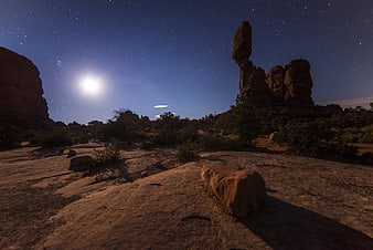 Night Sky Desert Landscape with Moon and Rock Formations