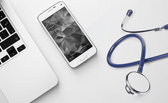 Medical Technology Concept With Smartphone, Laptop, And Stethoscope