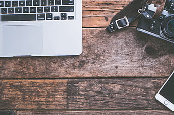 Rustic Workspace Flat Lay With Laptop, Camera, And Smartphone