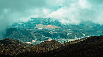 Aerial View of Misty Mountain Valley with Clouds