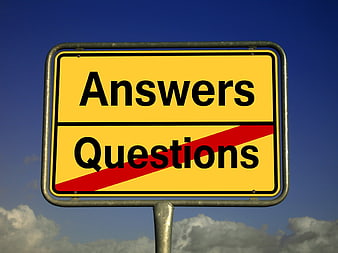 Yellow road sign with Answers and crossed out Questions