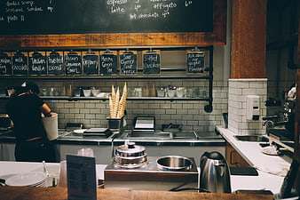 Ice Cream Shop Counter with Chalkboard Menu and Waffle Cones