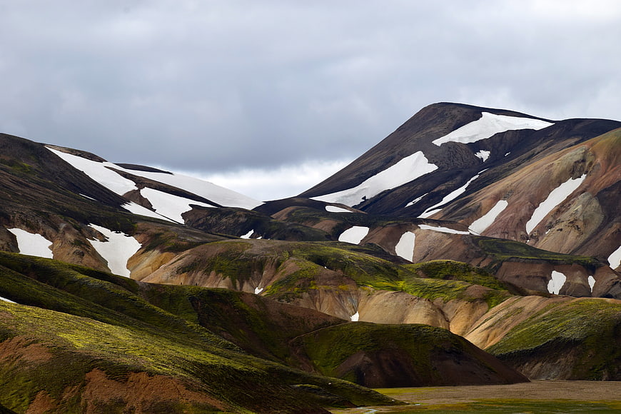 Colorful Icelandic Highlands with Snow Patches and Green Moss