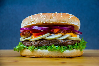 Delicious Gourmet Burger with Bacon, Cheese, and Vegetables