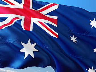 Australian National Flag Waving Against Blue Sky
