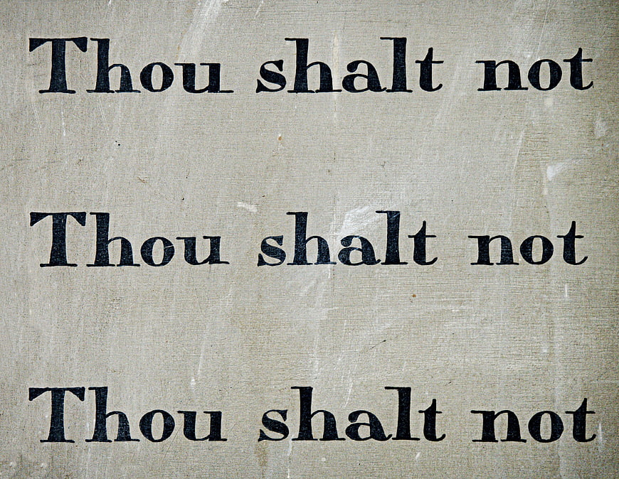 Vintage 'Thou Shalt Not' Text on Aged Paper Background