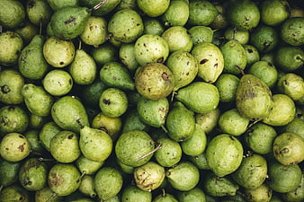 Top view of fresh green pears in a pile