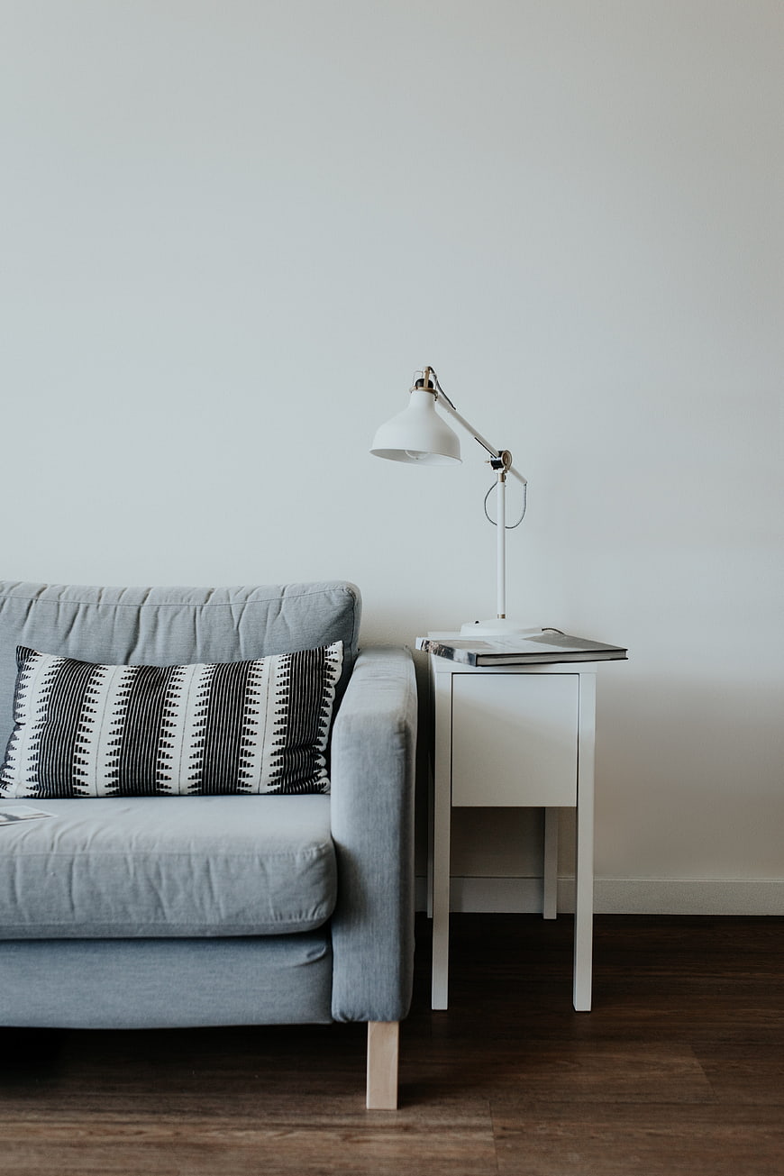 Minimalist Living Room with Grey Sofa and White Lamp