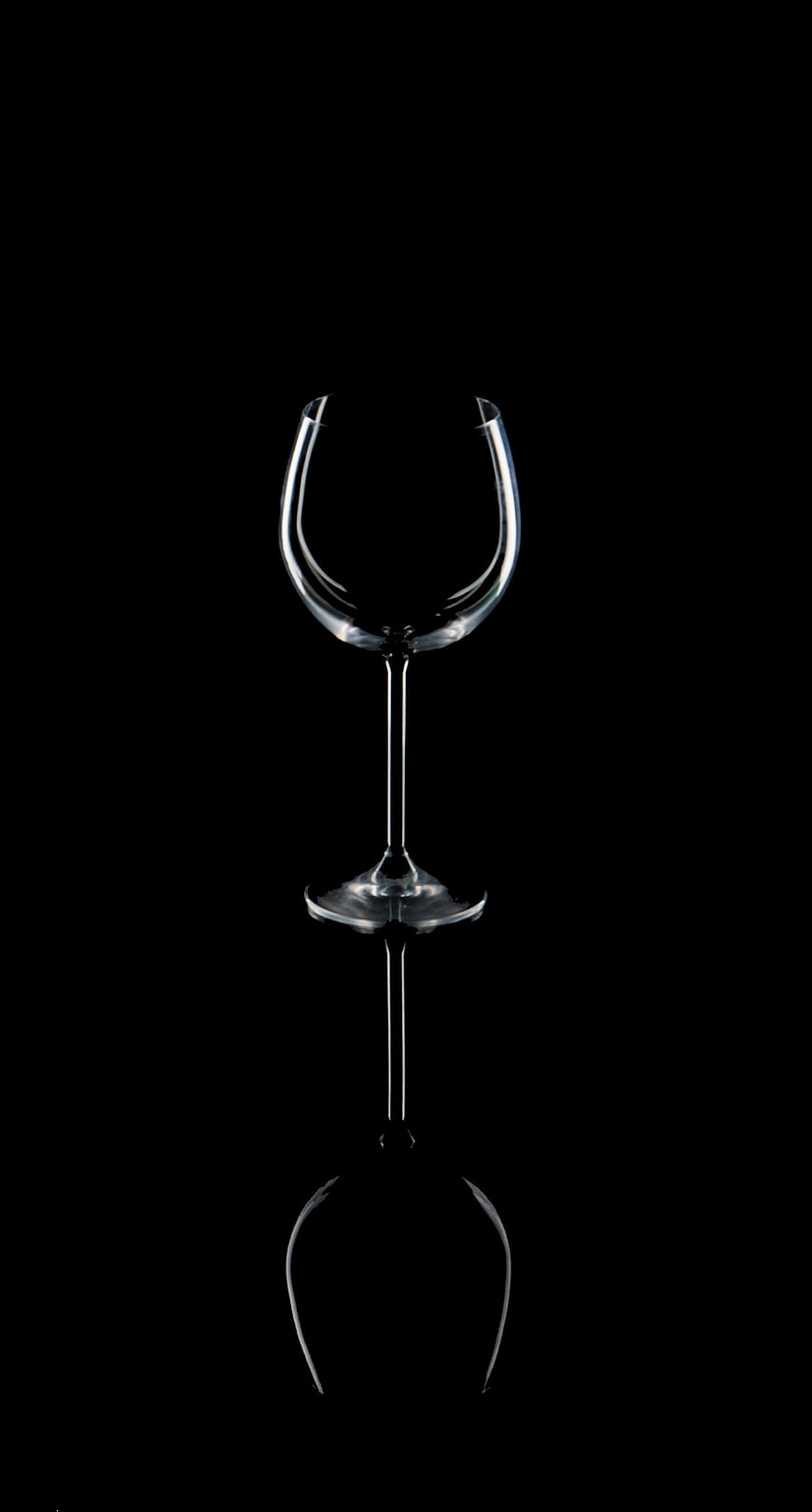 Elegant Empty Wine Glass with Reflection on Black Background